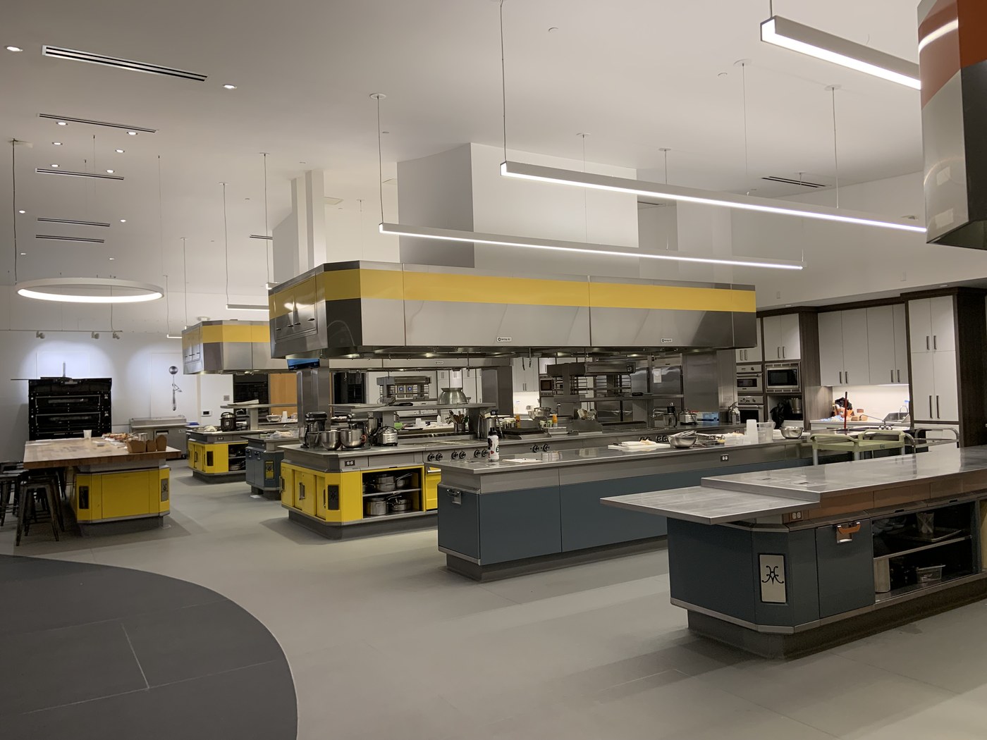 Stainless steel cooking stations in a professional restaurant kitchen